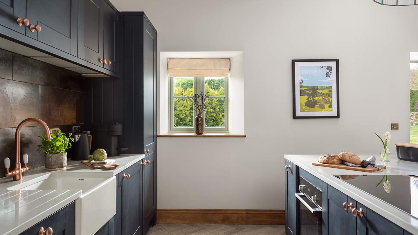 The kitchen comes fully equipped with everything the exacting chef might need...