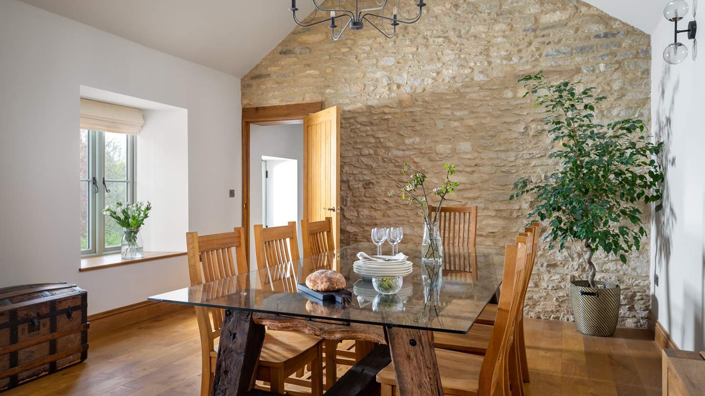 The pretty dining table, with reclaimed beams from the barn, is the perfect setting for spectacular dinner parties