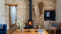 The deliciously cosy wood burner keeps things warm during cooler months, alongside the underfloor heating
