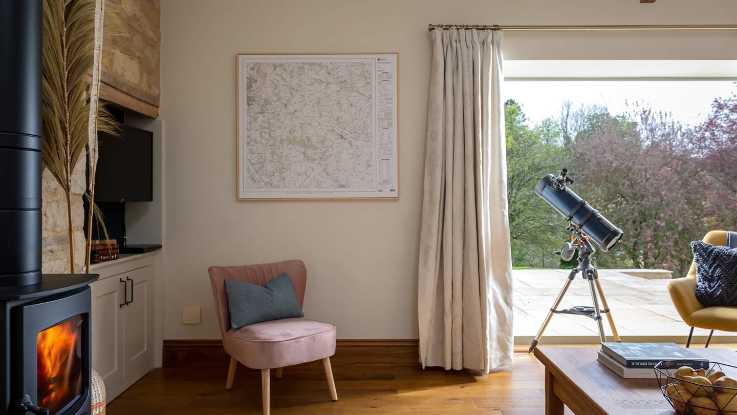 Bi-fold doors lead out on to the patio, perfect for a spot of stargazing with the telescope