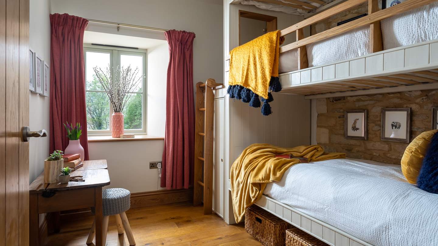 The third bedroom is a delightful bunk bed room, we just love the stairs that lead up to the top bed!