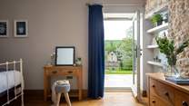 The master bedroom, with door leading on to the patio - perfect for a wake-me-up coffee and early morning birdsong!