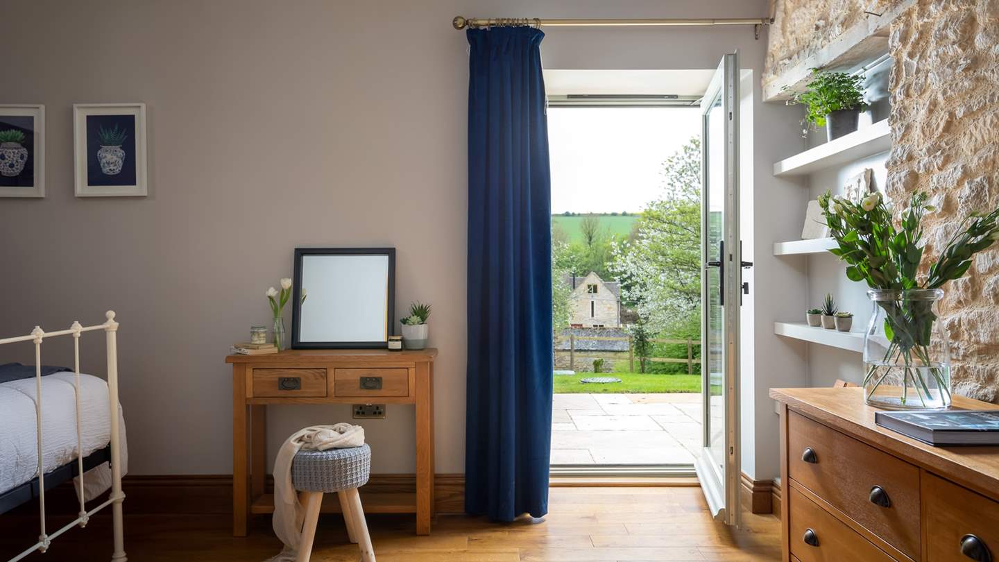 The master bedroom, with door leading on to the patio - perfect for a wake-me-up coffee and early morning birdsong!