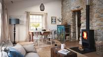 Exposed Cornish stone walls and beautiful wooden flooring create a lovely open plan living space - perfect for families and couples alike