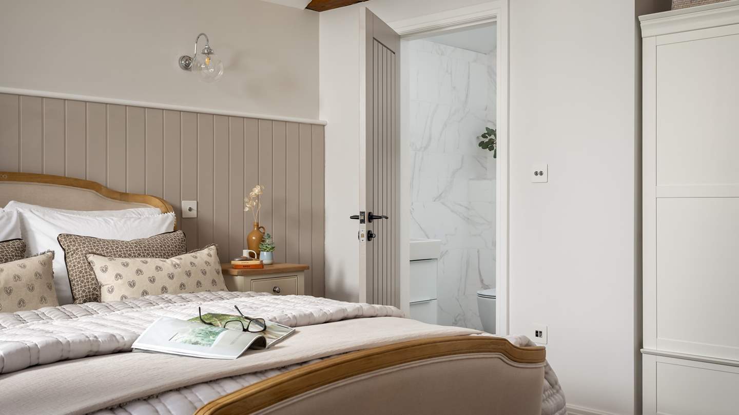 Alongside plenty of storage, there is also an en suite shower room