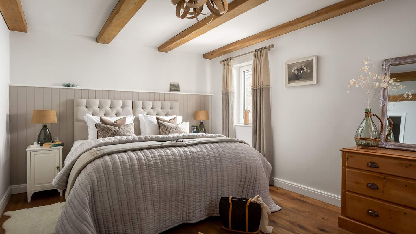 The second bedroom has a zip-and-link bed, meaning it can be made up as twins or kept as a super king size bed, for flexible sleeping arrangements