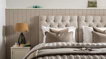 Both beds are swathed in White Company linens and cosy bedding