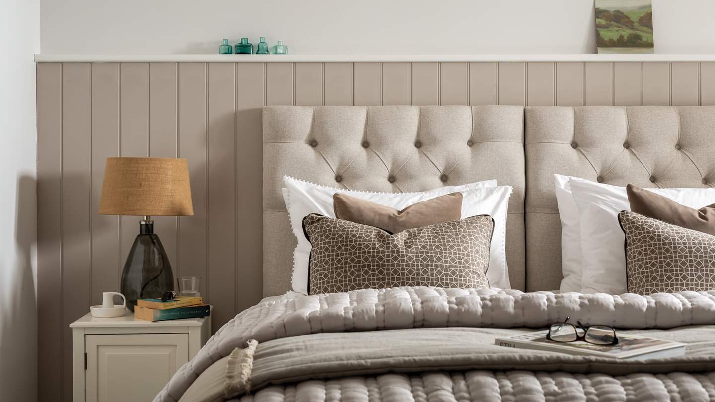 Both beds are swathed in White Company linens and cosy bedding