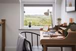 The landing is home to a desk, perfect if you need to catch up with an email or two - or for any creative work