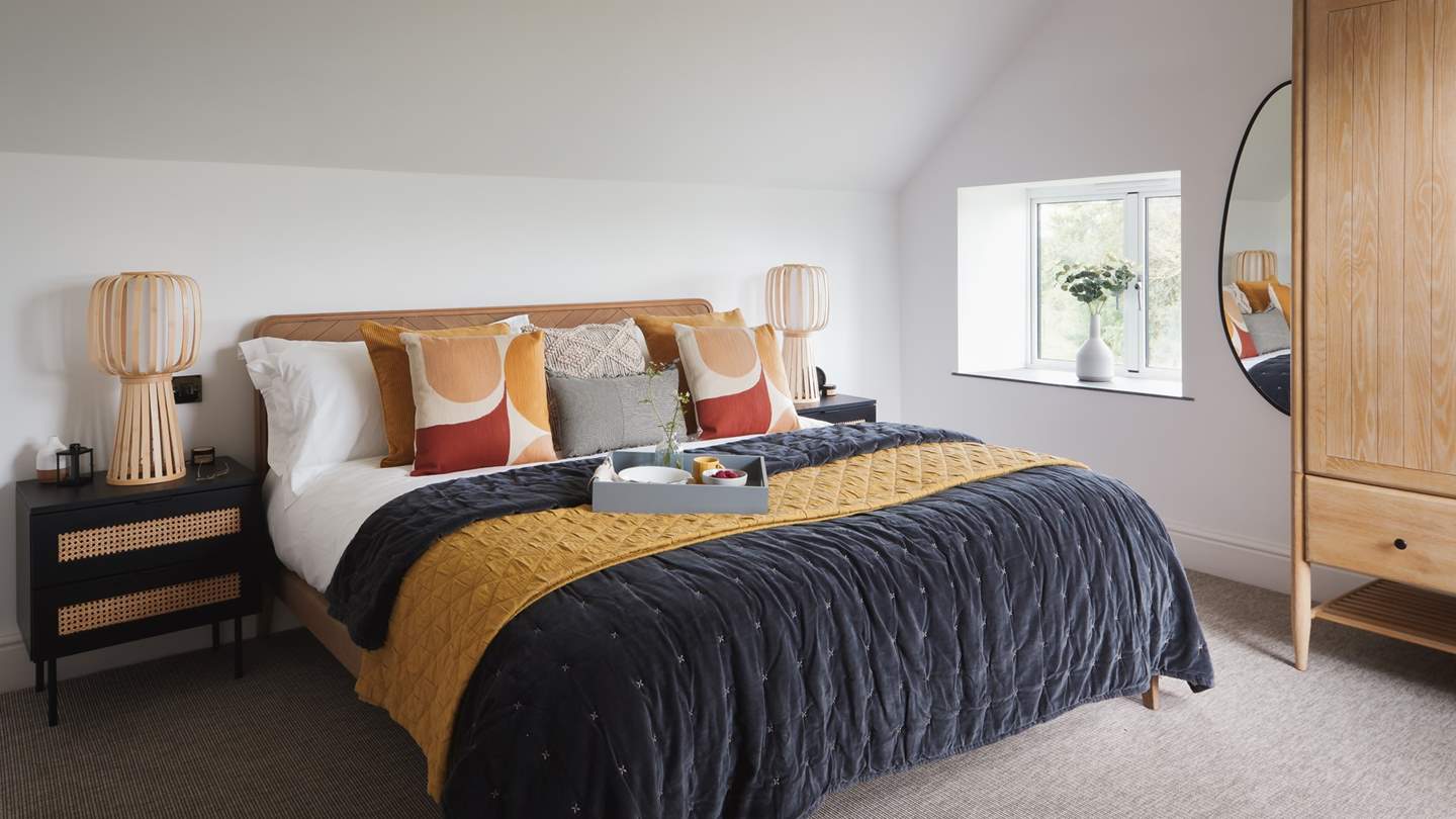 The sumptuous super king-sized bed, made for long lie-ins and breakfast in bed