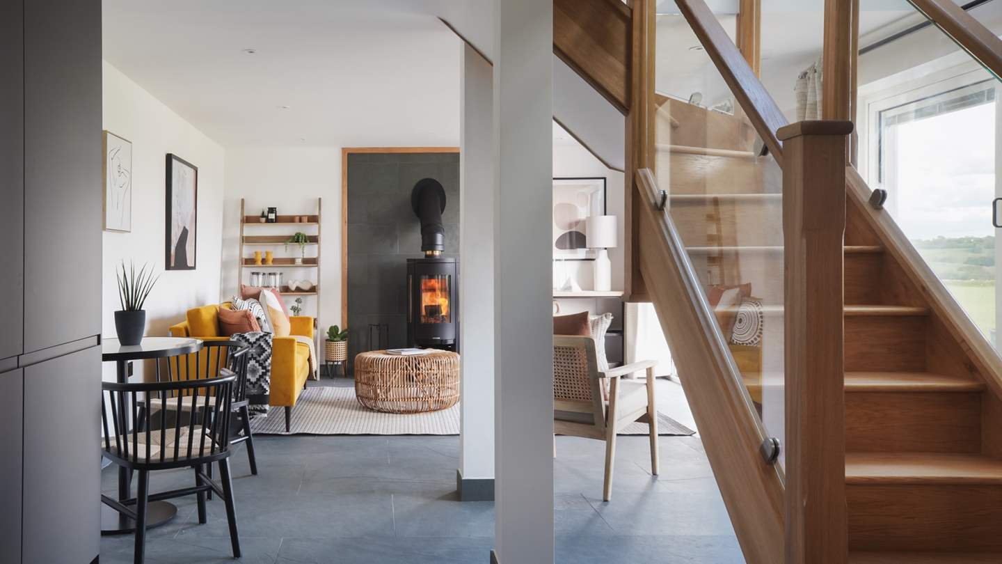 The gorgeous wooden stairs lead up from the centre of the room