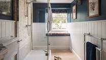 Inside you'll find a large walk-in shower and another lovely window seat 