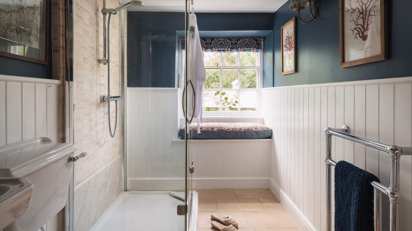 Inside you'll find a large walk-in shower and another lovely window seat 