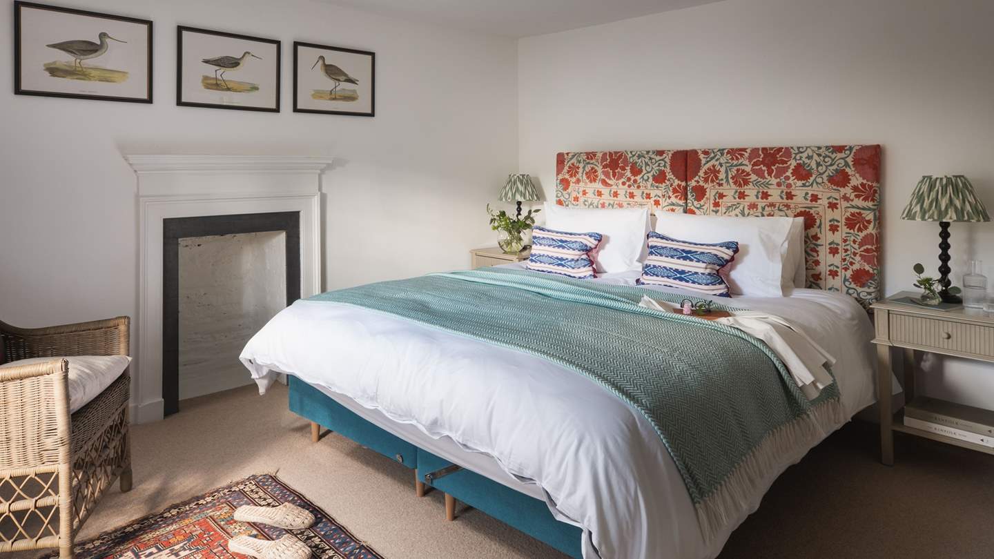 The second bedroom in subtle green, blue, and red hues
