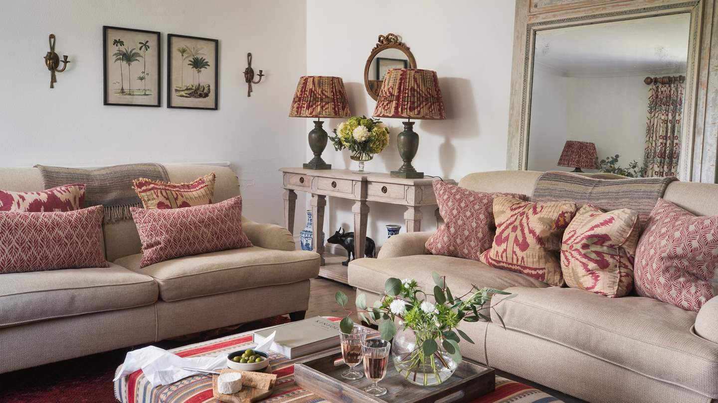 With three plump sofas, this is the perfect place to unwind in the company of loved ones... 