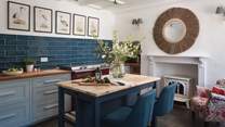 The farmhouse kitchen is just divine with shades of blue perfectly complimenting the wooden finishes 