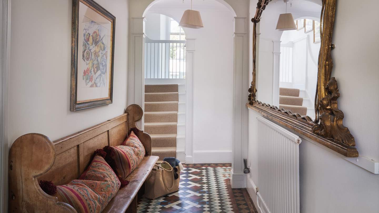 The hallway with beautiful gold finishes and earthy tones