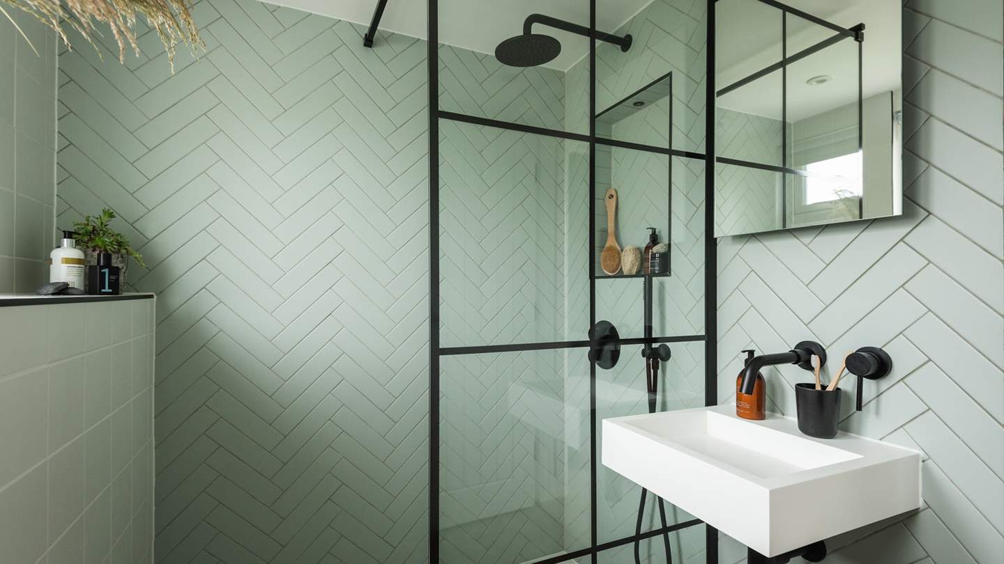 The upstairs bedrooms share a shower room with a stylish walk-in shower