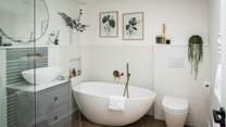 The lovely en suite has a freestanding bath, perfect for long, bubbly soaks