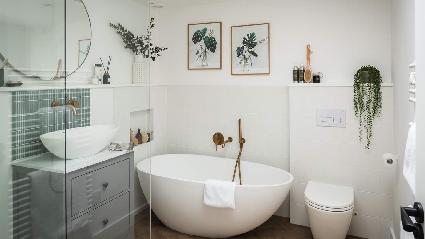 The lovely en suite has a freestanding bath, perfect for long, bubbly soaks