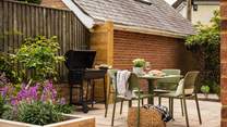 The garden comes with a sleek charcoal barbeque