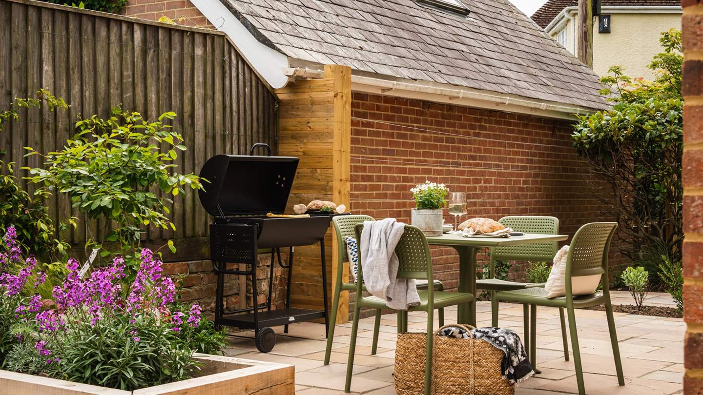 The garden comes with a sleek charcoal barbeque