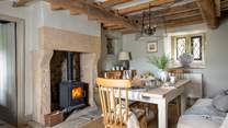 The fabulous dining room with its own wood burner is made for celebratory meals