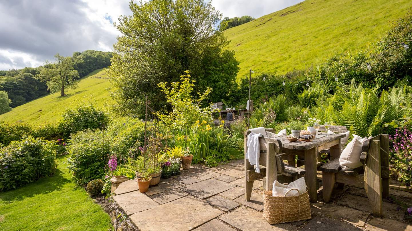 The first tier has a fantastic position and benefits from lots of sunshine, surrounded by flowers