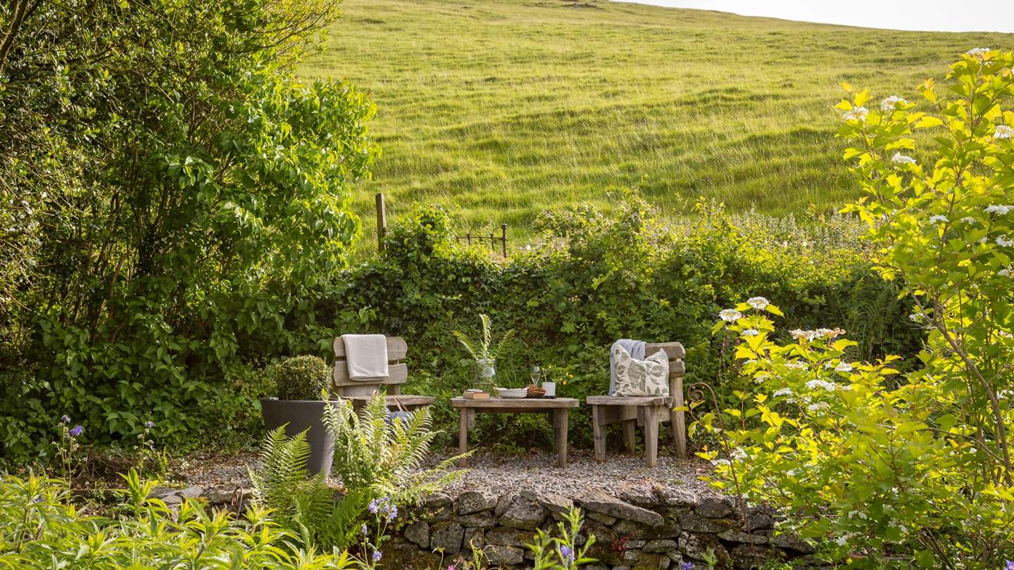 The upper level backs on to the hill beyond, a tucked-away corner that's perfect for evening drinks