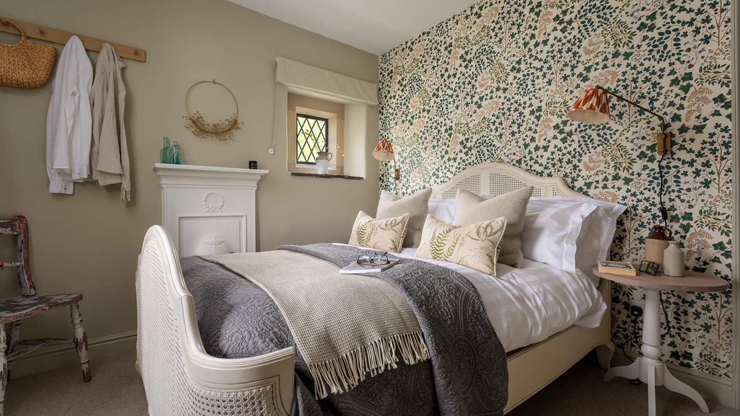 The third bedroom is a charming double, with original feature fireplace and gorgeous wallpaper