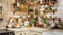 Kilner jars and collectables line the walls of the beautiful kitchen