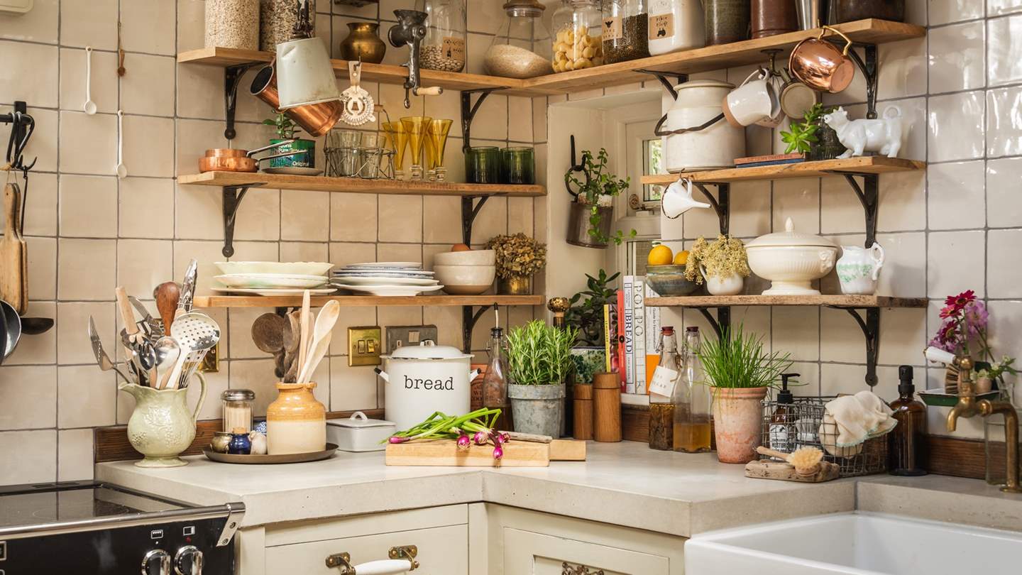 Kilner jars and collectables line the walls of the beautiful kitchen