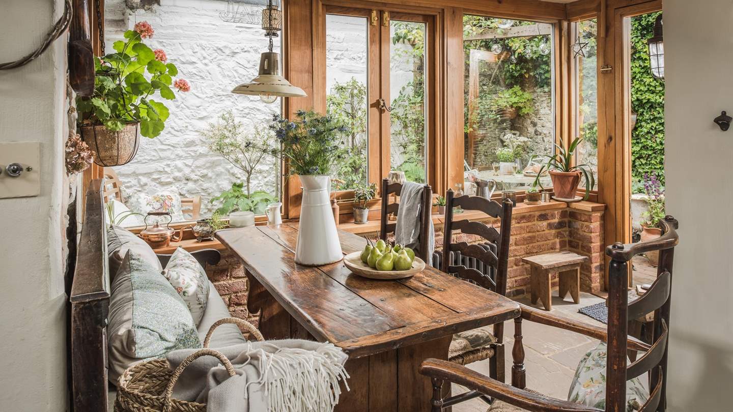 The kitchen comes complete with antique oak rectory table, chairs, and a 17th century monk's bench for dining
