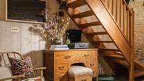 The oak stairs lead up to the second bedroom