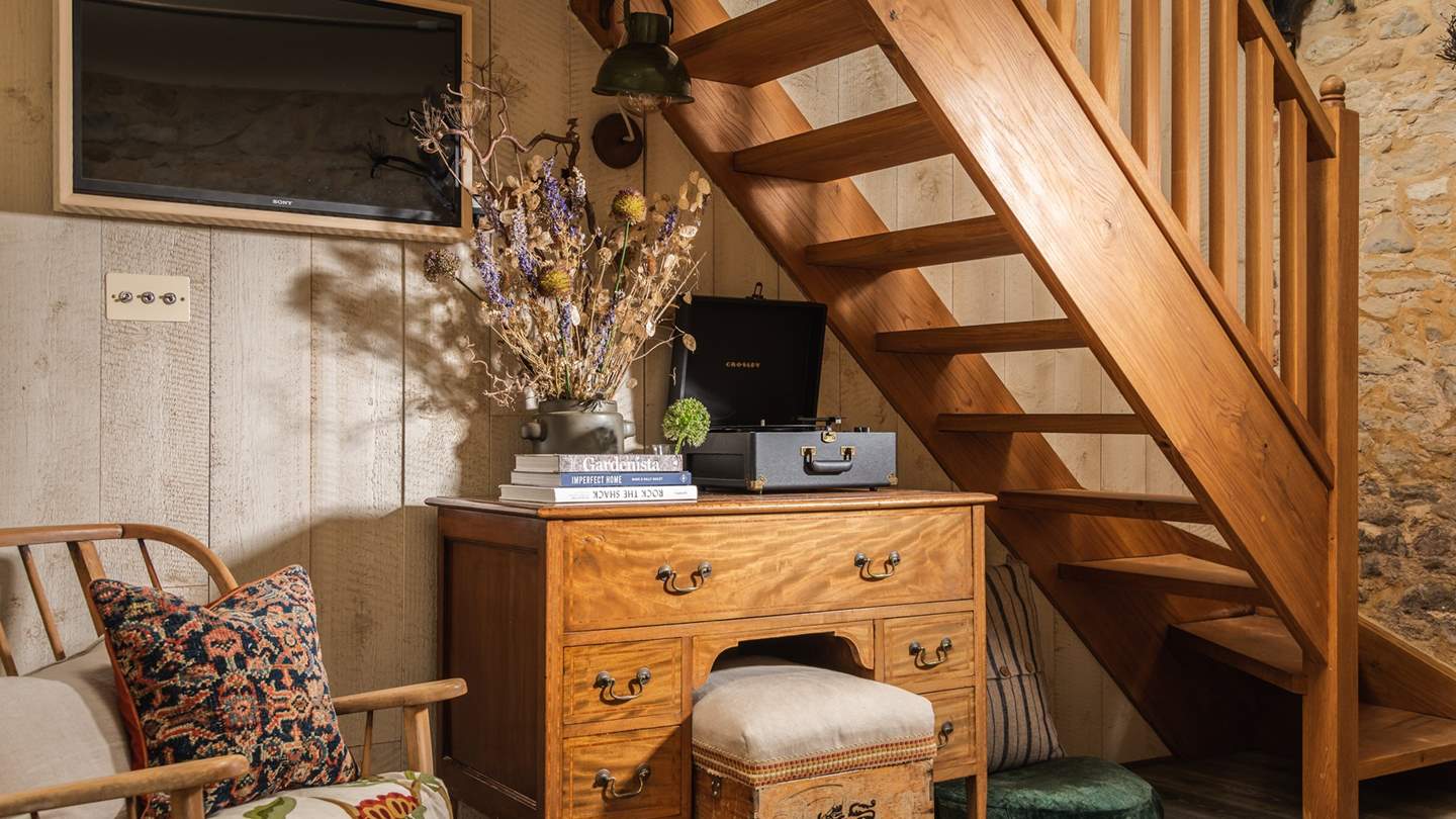 The oak stairs lead up to the second bedroom