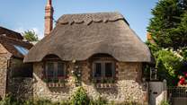 Bedecked in thatch and climbing roses and with golden stone walls and pretty lead-lined windows, Olea is as close to ‘chocolate box pretty’ that it gets!