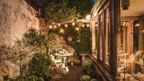 Outside, the gorgeous, mature courtyard garden is the dreamiest escape
