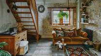 The oak stairs lead up to the second bedroom