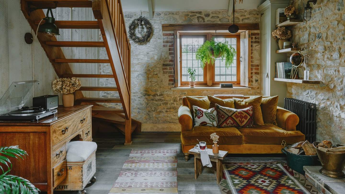 The oak stairs lead up to the second bedroom