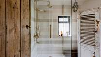 The family shower room is set on the ground floor next to the master bedroom. This lovely room has a walk-in shower for rejuvenating morning rituals