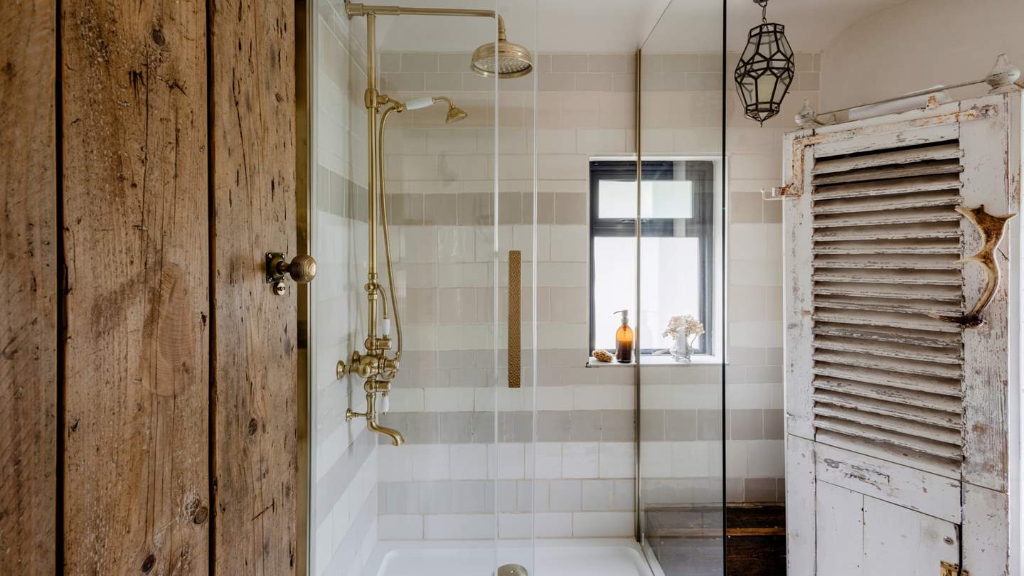 The family shower room is set on the ground floor next to the master bedroom. This lovely room has a walk-in shower for rejuvenating morning rituals
