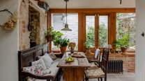 The kitchen comes complete with antique oak rectory table, chairs, and a 17th century monk's bench for dining