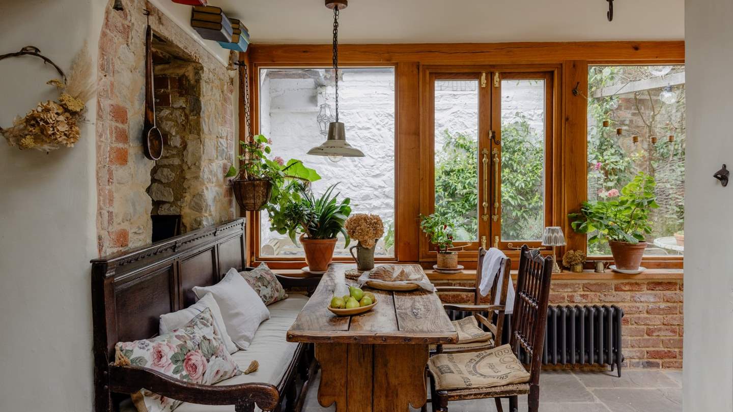 The kitchen comes complete with antique oak rectory table, chairs, and a 17th century monk's bench for dining