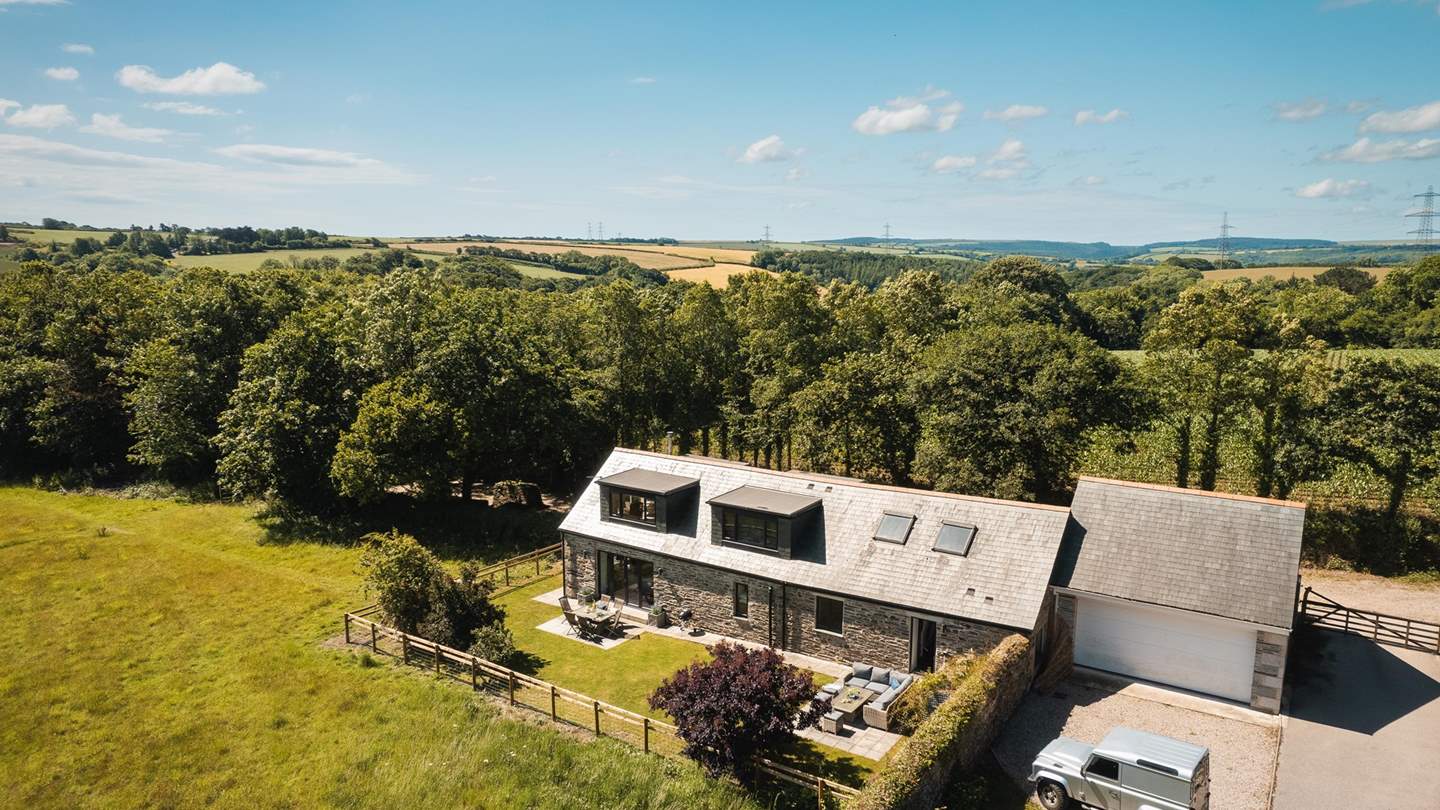 Surrounded by woods and fields, it's a tucked-away retreat