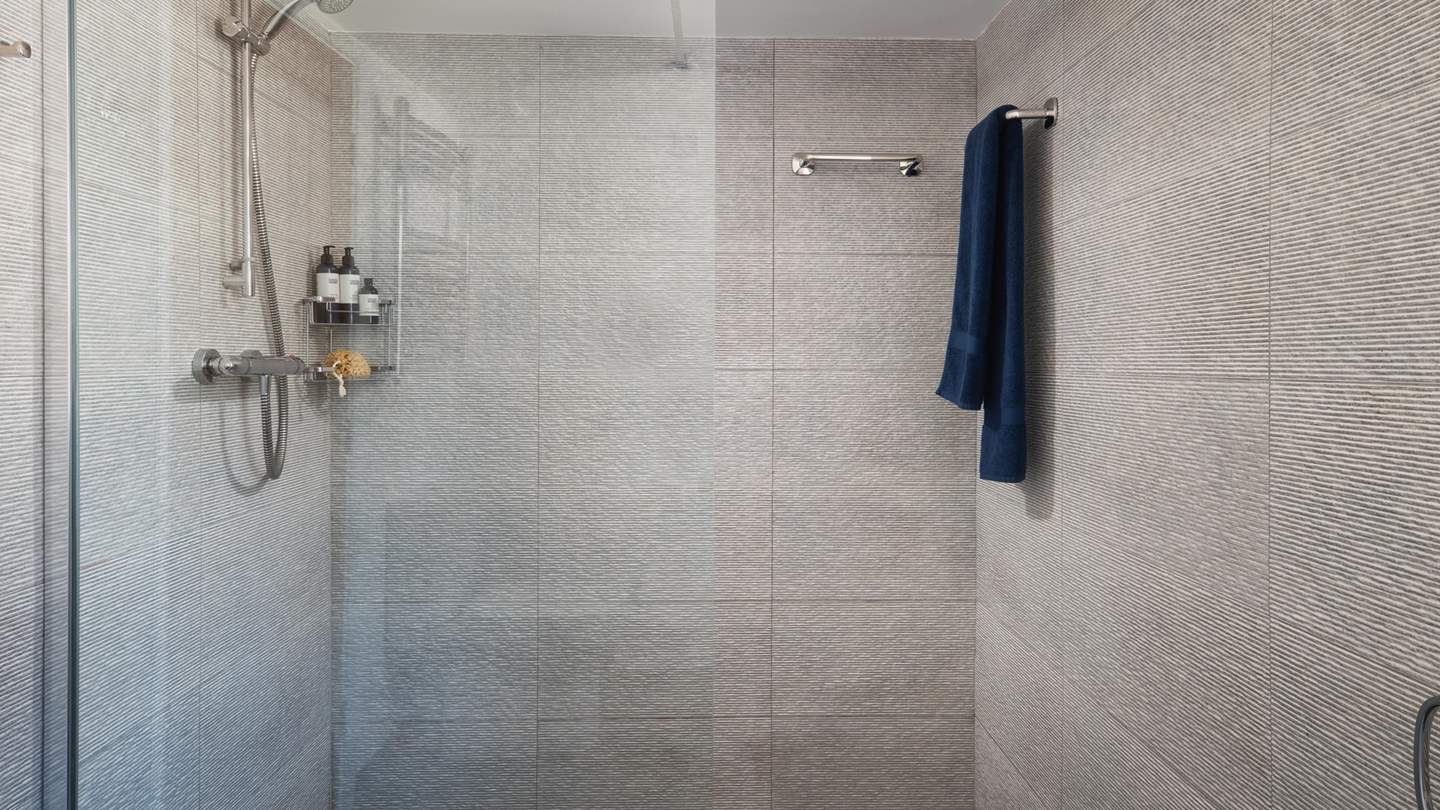 The second and third bedroom share a large walk in shower room, located on the ground floor