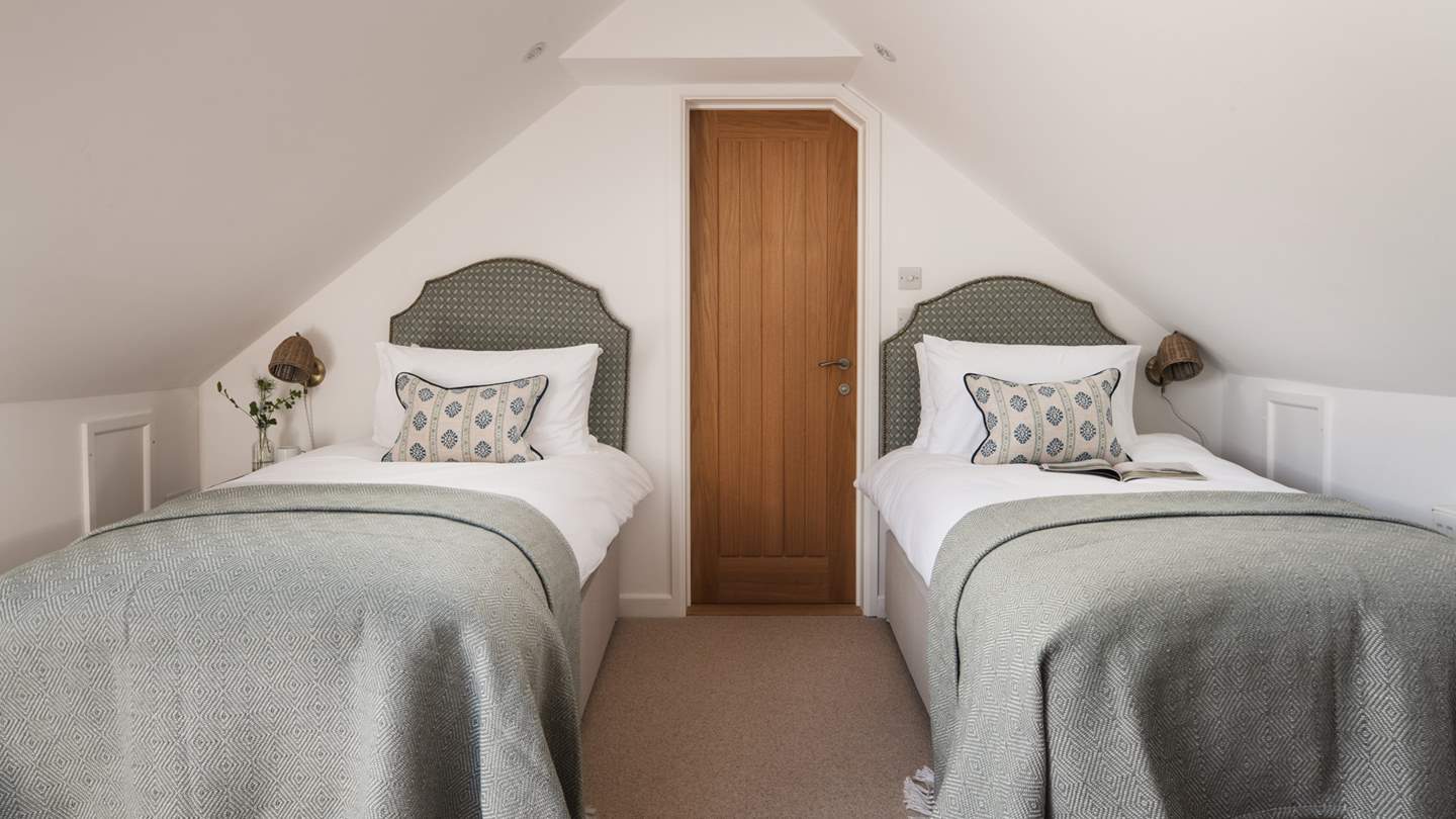 The second bedroom with twin beds, that's interconnected to the master bedroom, so great for children