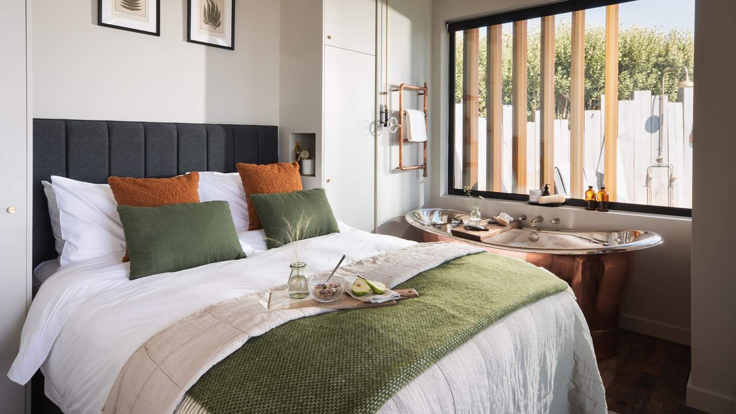 The beautiful bedroom complete with a king-sized bed... 