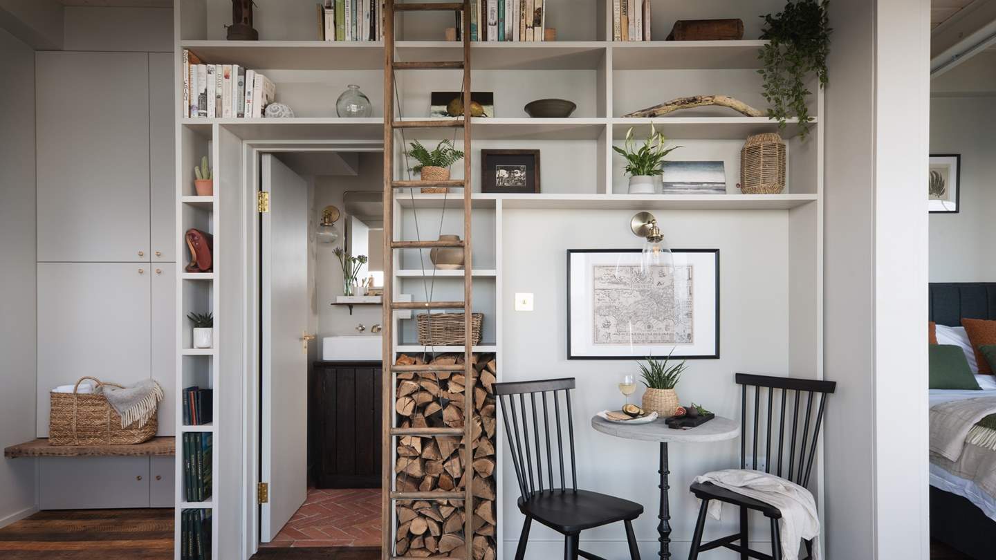 The eye-catching library-style shelving and antique ladder 
