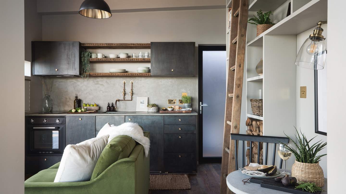 The open-plan living space is simply sumptuous in richly coloured hues 