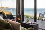 Admire the mesmerising sea views from the comfort of the gorgeous green sofa....